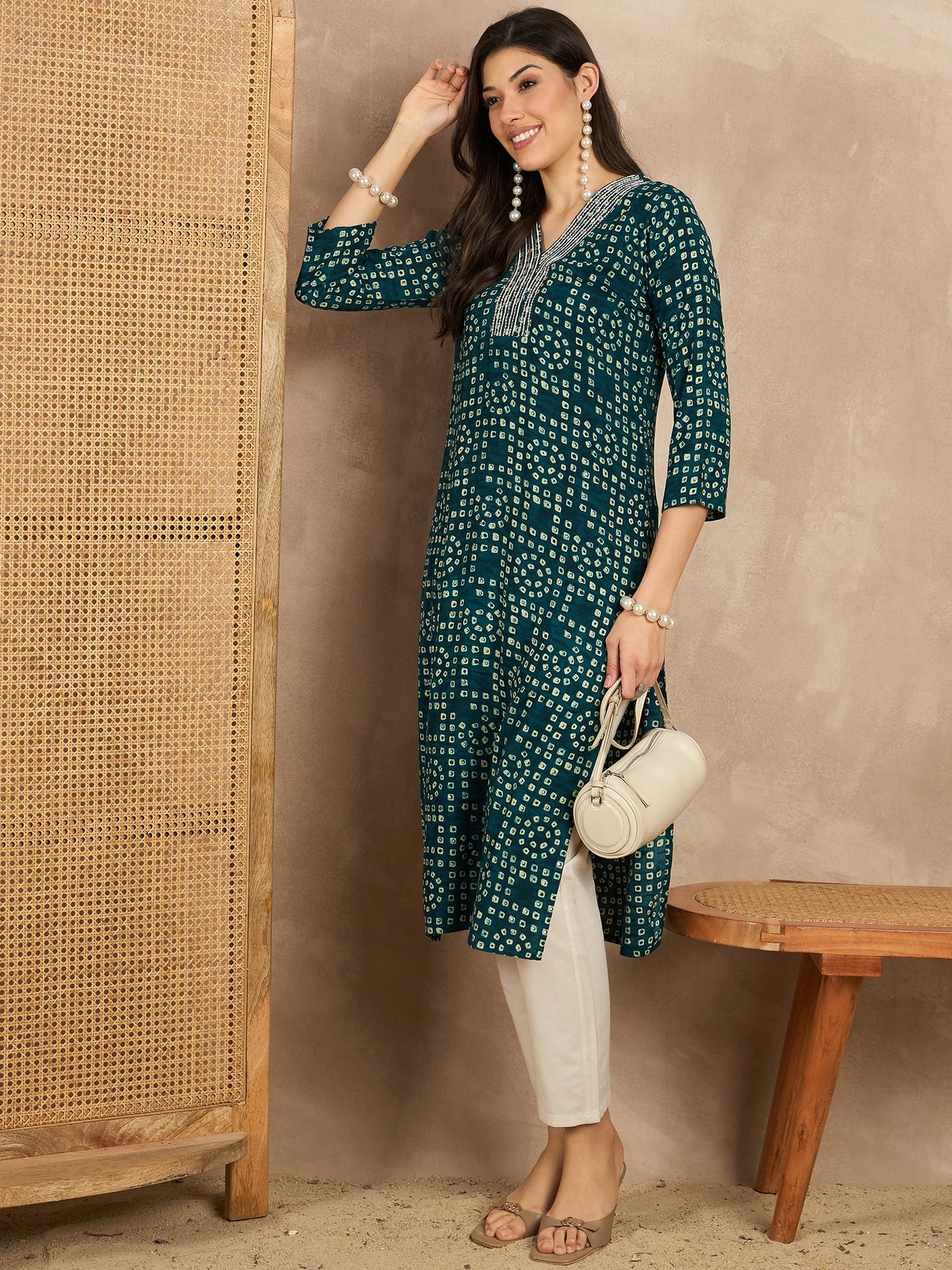 WOMEN VISCOSE RAYON STRAIGHT KURTI EMBLISHED WITH HAND WORK ON V-NECKILINE YOKE